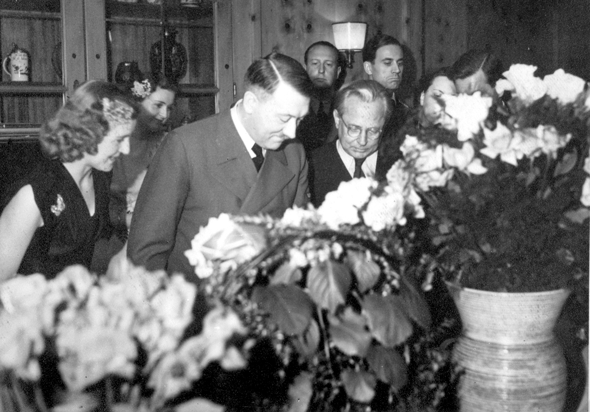 Adolf Hitler with Eva Braun and his photographer Heinrich Hoffmann during the 54th birthday celebration of the Führer, from Eva Braun's albums